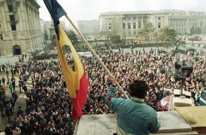 Waving a Flag Above Crowd